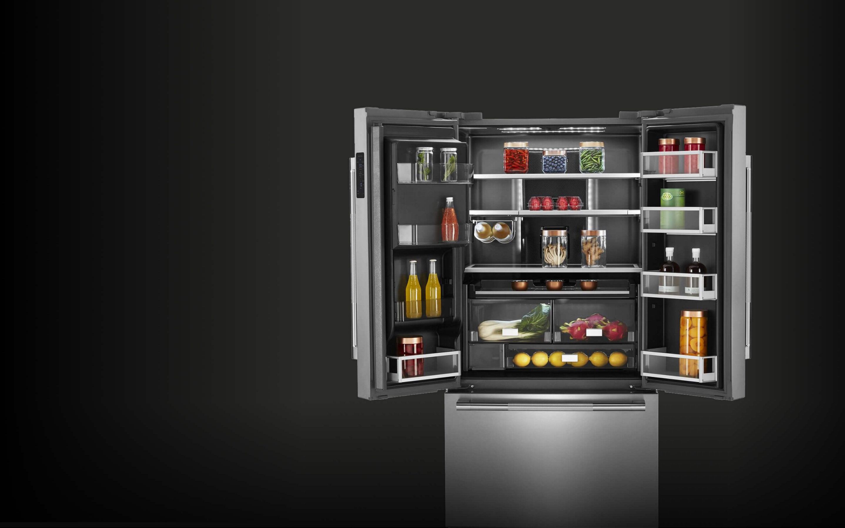 The rich dark interior of a JennAir® French Door Refrigerator.