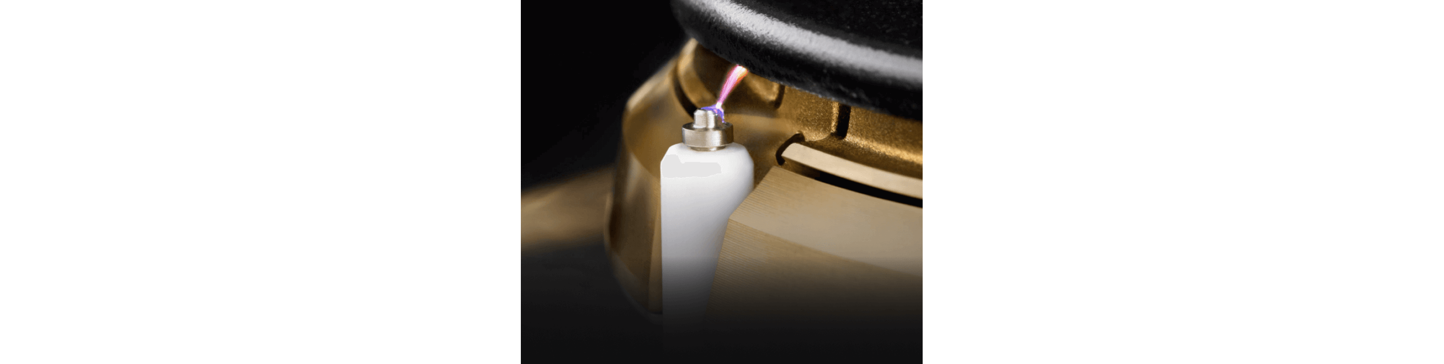 A close up of the lighting mechanism of a burner.