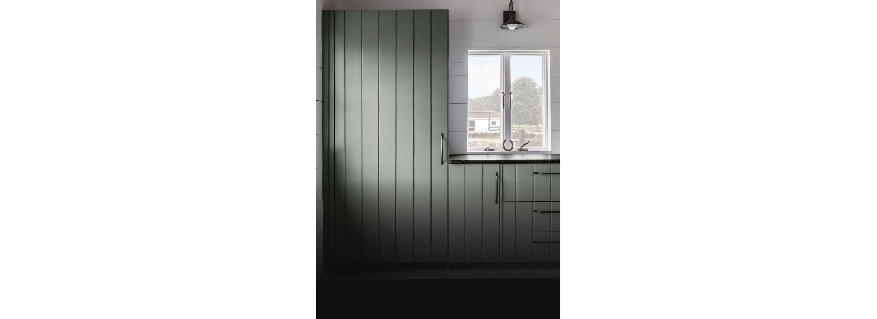 A panel-ready refrigerator seamlessly fitting in with surrounding cabinetry.