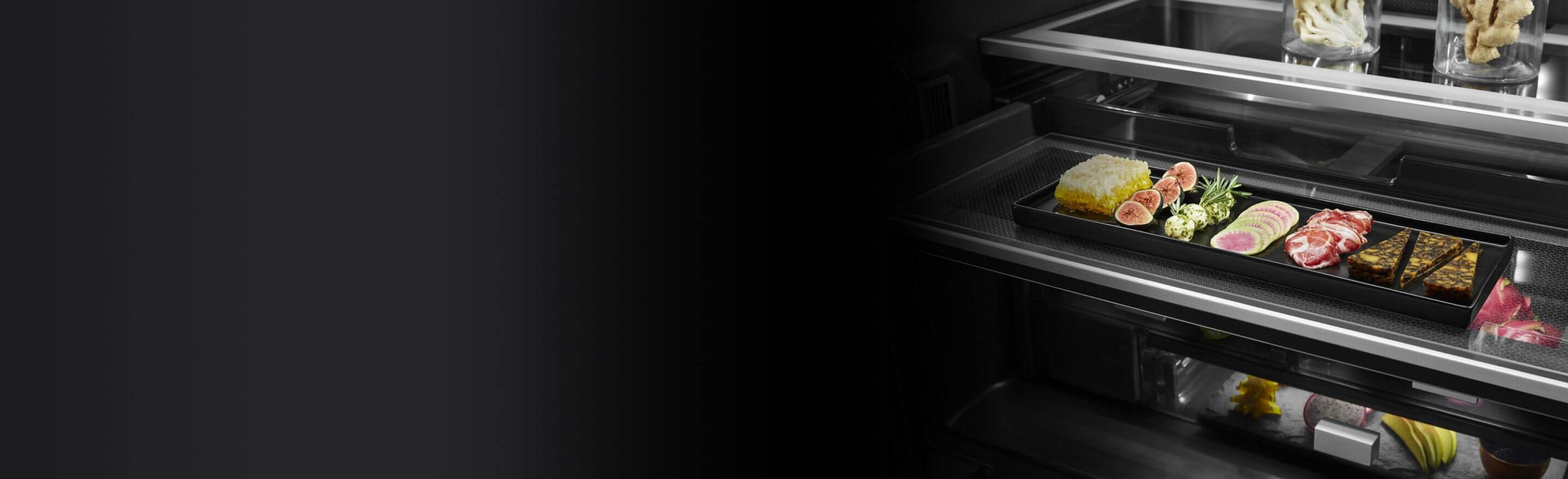 An open JennAir® Freestanding Refrigerator next to a close up of its interior.