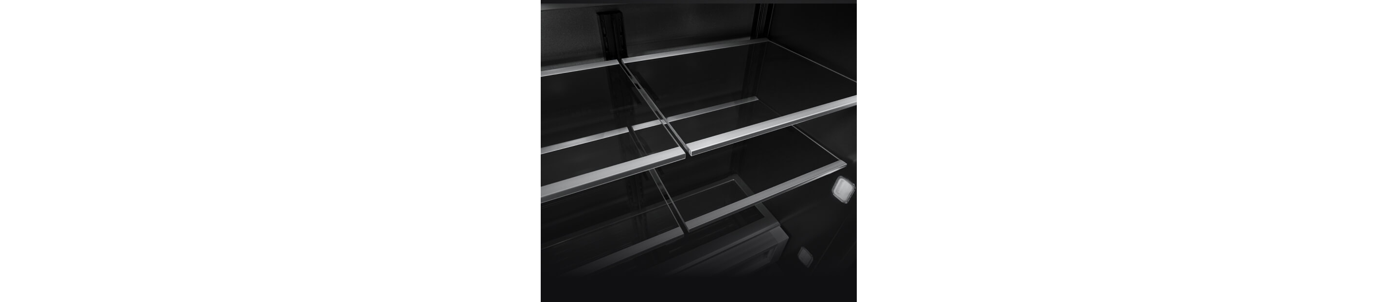 The glass and metal shelves in a JennAir® built-in refrigerator.