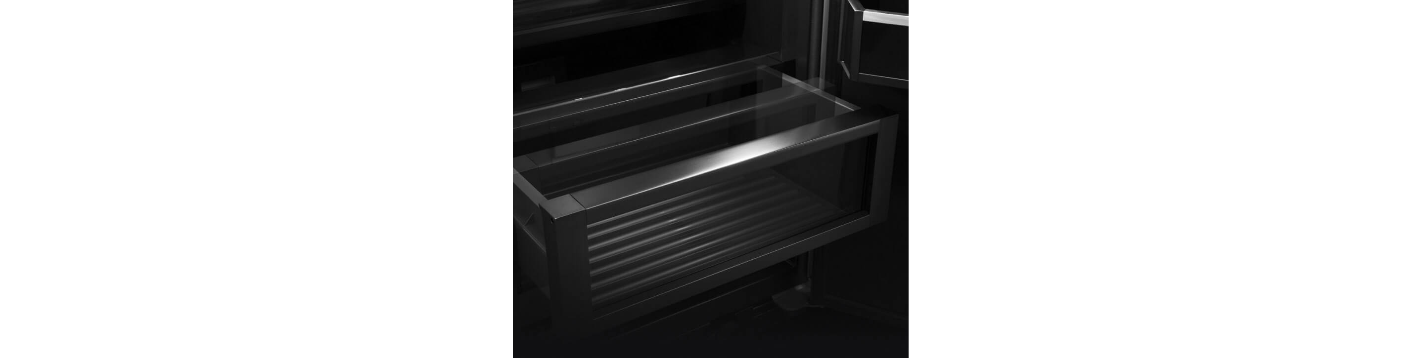The drawers inside of a JennAir® built-in refrigerator.