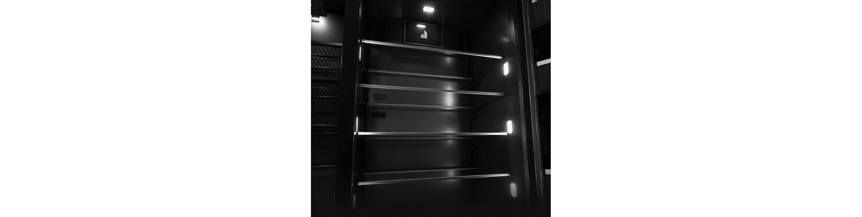 The shelves inside a built-in refrigerator.