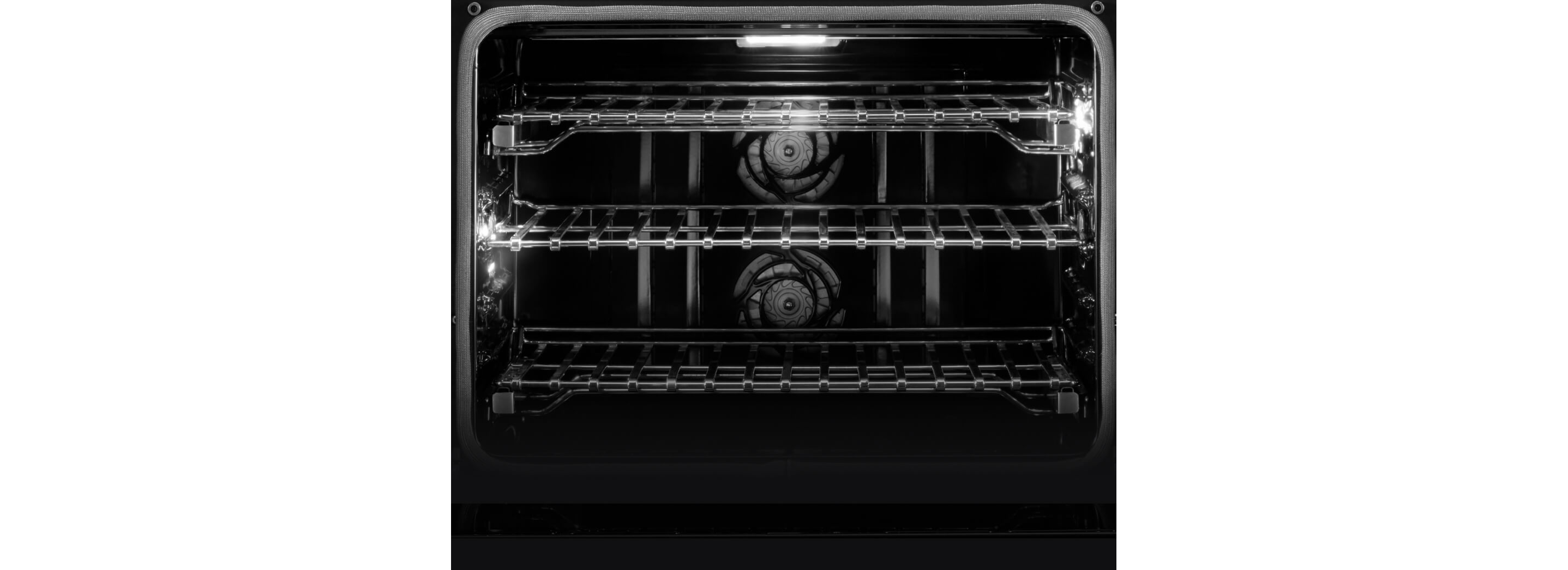 Interior view of a JennAir® Wall Oven, showing the dual convection fans.