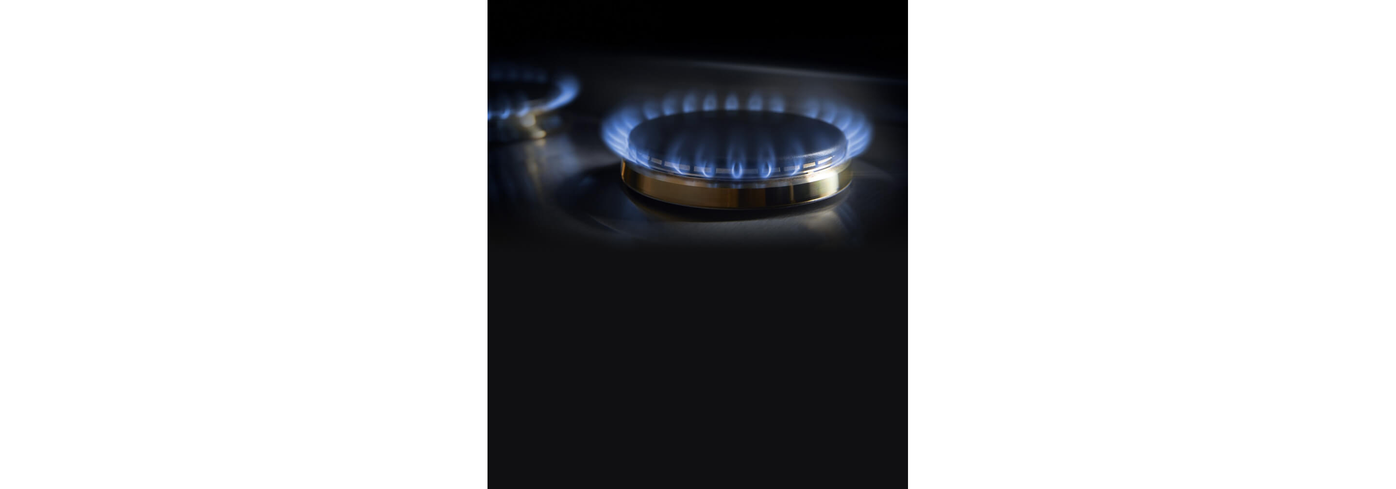 The lit burners on the 2-burner gas custom cooktop.