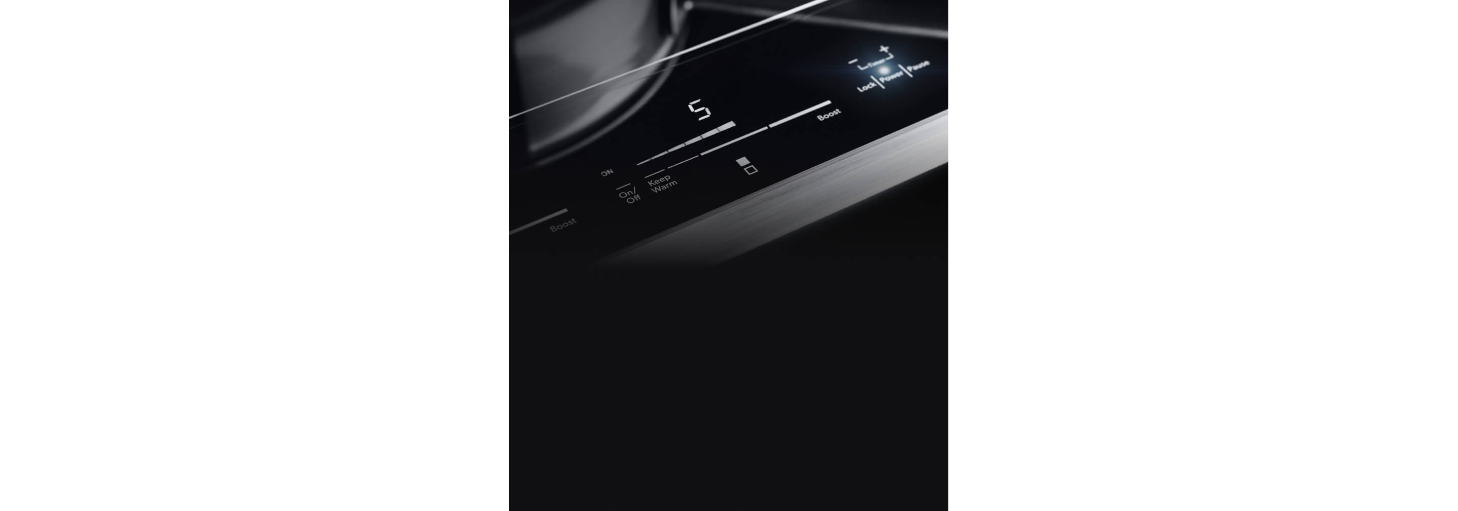 The lit controls of the 15-inch induction cooktop.