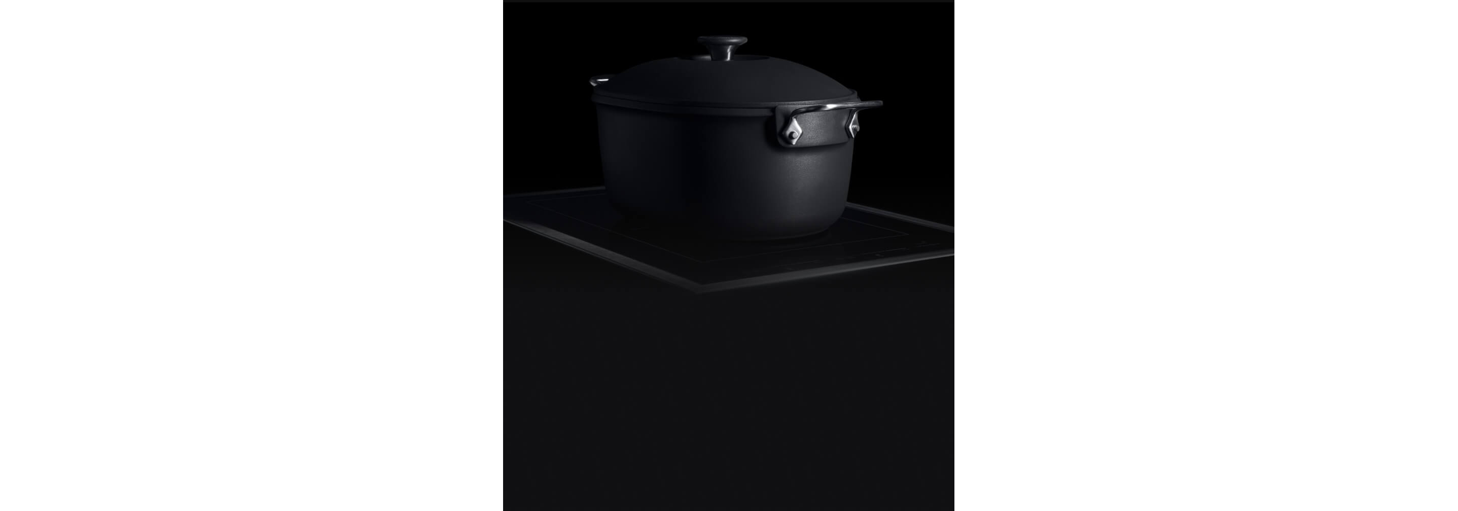A JennAir 15-inch Induction Flex Cooktop with a cast-iron dutch oven.