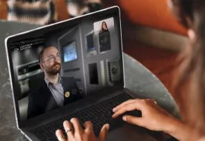 A person interacting with an appliance expert via video call.