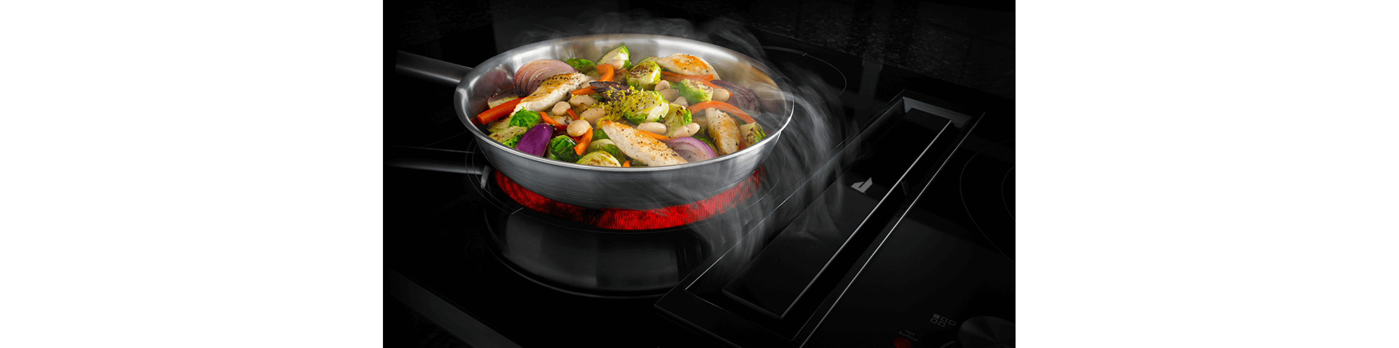 A top-down shot of a five-burner gas cooktop.