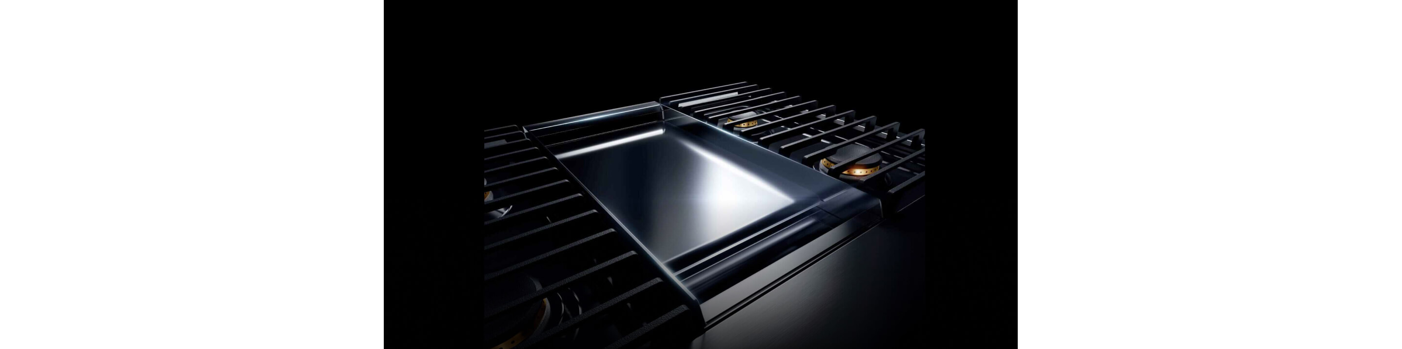 A JennAir® NOIR™ 48-inch range with a chrome-infused griddle.