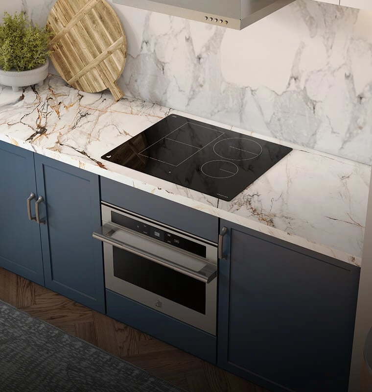 An updraft induction cooktop in a white and blue kitchen.