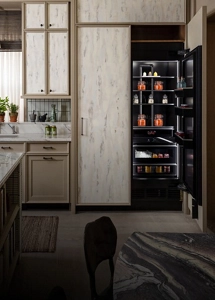 A luxury kitchen with a custom panel clad column.