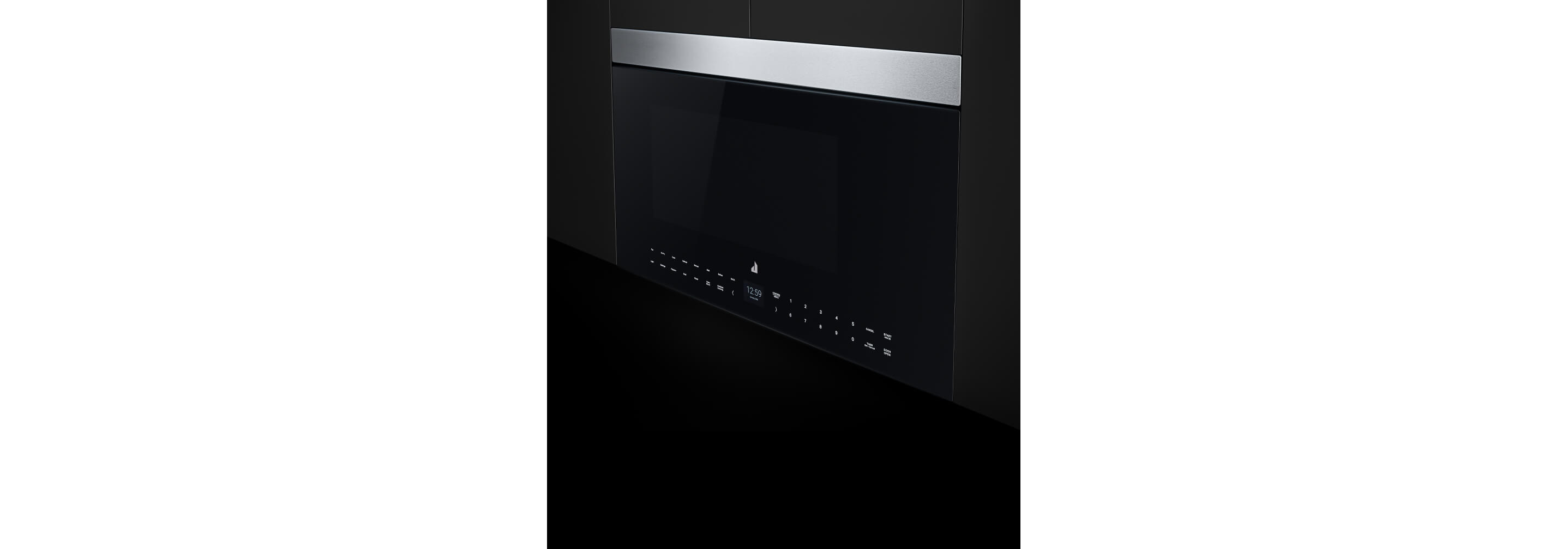 A flush oven hood microwave installed in a bank of black upper cabinets.