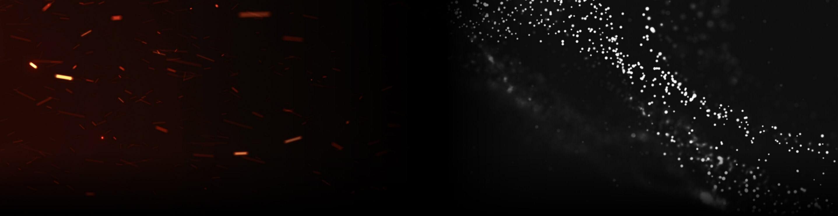 Red sparks and white particles on a dark background.