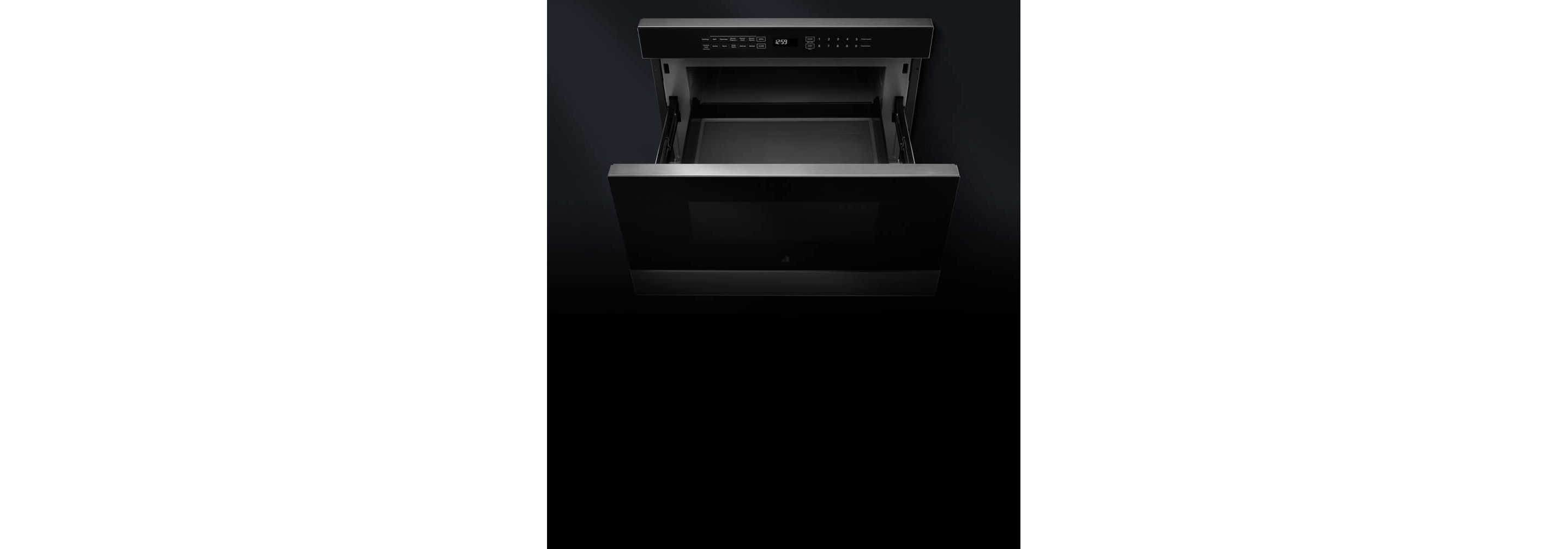 An open microwave drawer.