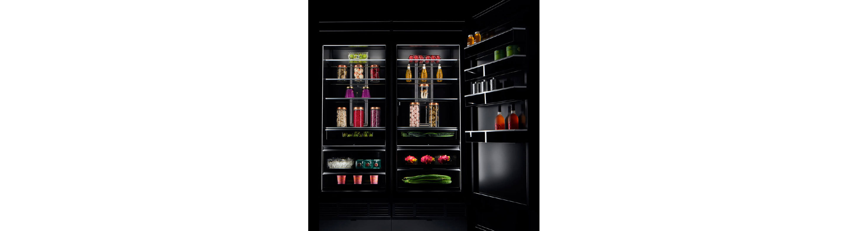 The interior of a JennAir refrigerator stocked with luxurious ingredients and fine foods. 