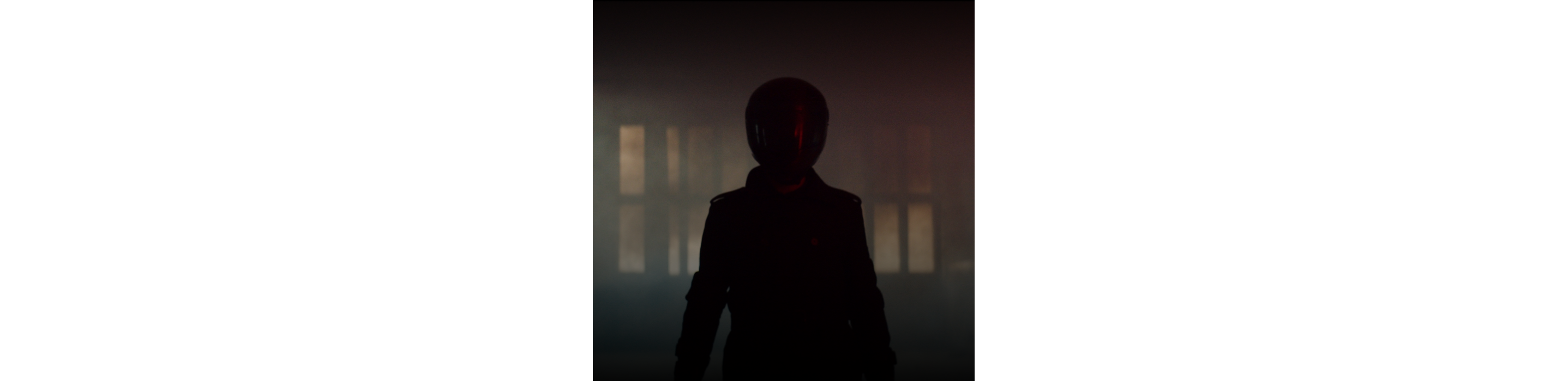 A silhouette of a motorcycle rider. 
