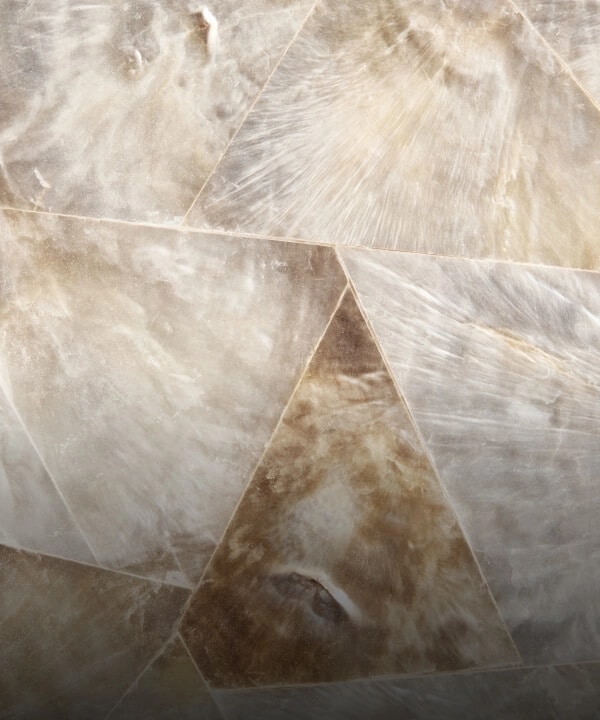 A triangular mosaic pattern made out of Capiz shell, called Capiz Copper.