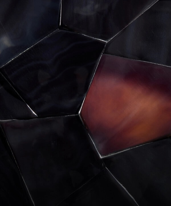 A burgundy tortoiseshell pattern made out of dark Pen shell, called Dark Pen Carnelian.