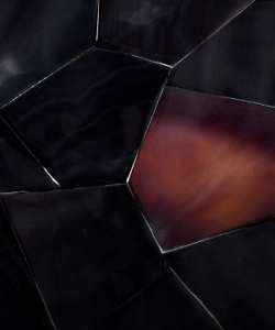 A burgundy tortoiseshell pattern made out of dark Pen shell, called Dark Pen Carnelian.