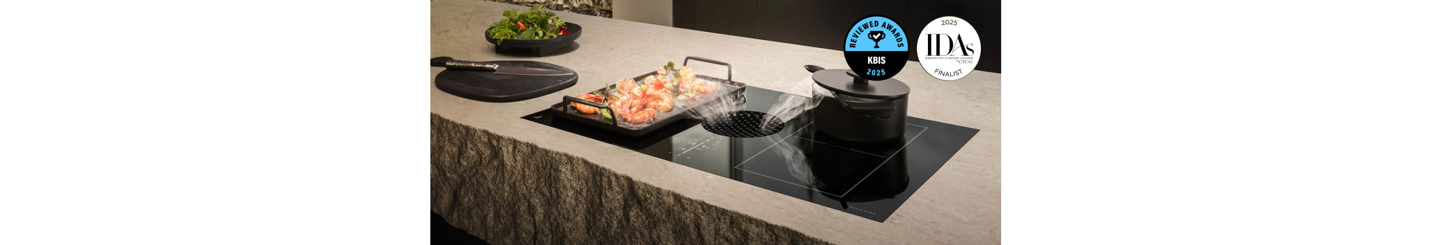 A JennAir Electric Downdraft Cooktop drawing steam from food cooking in a pan.