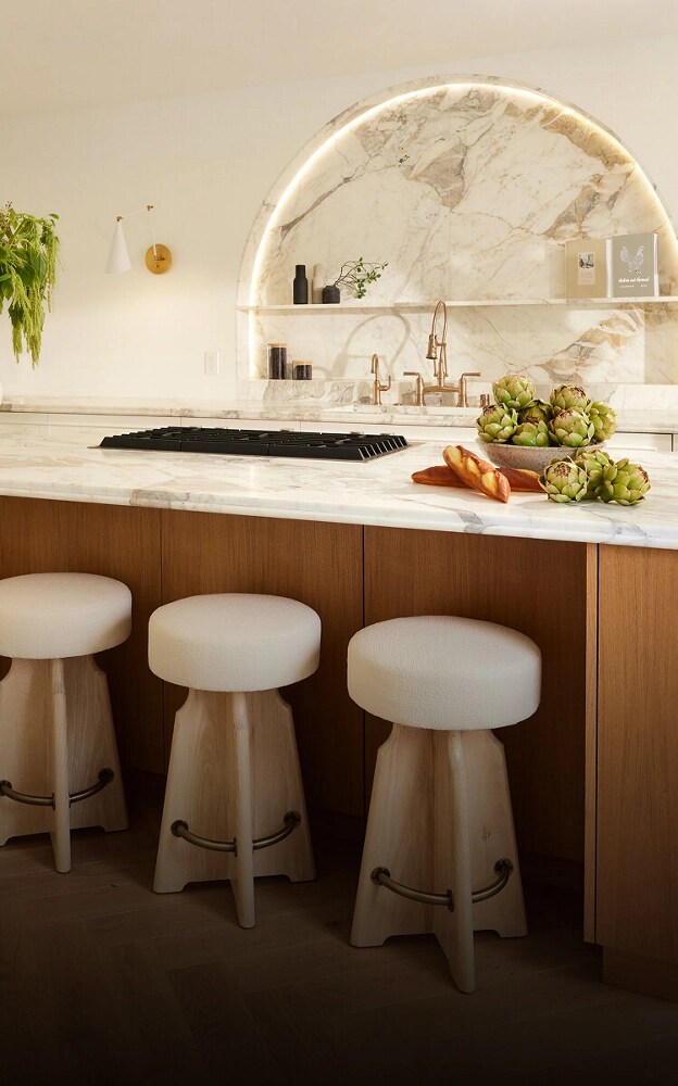 A bright, airy kitchen featuring organic colors and JennAir® appliances.
