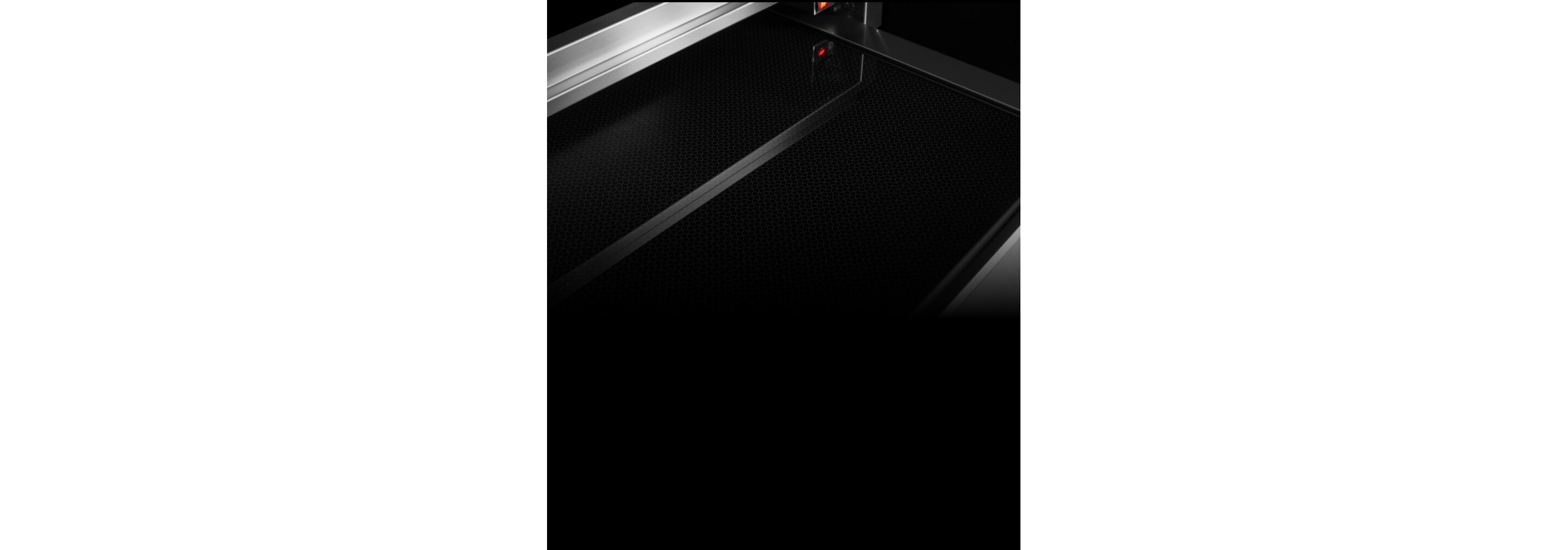 The interior of the warming drawer, displaying the black glass bottom.