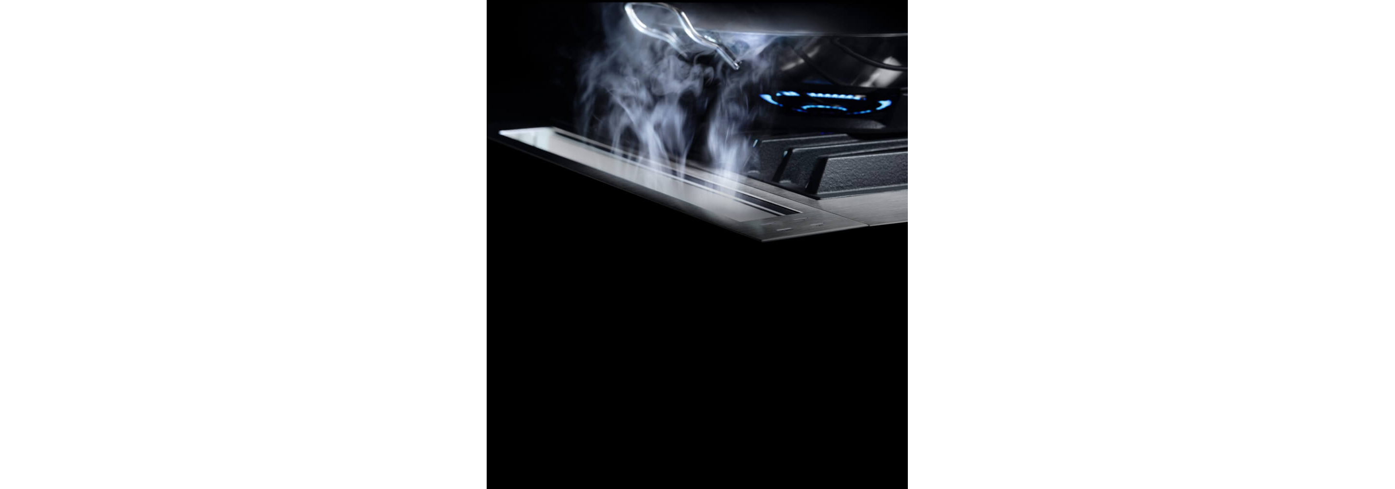 The 4-inch downdraft strip drawing steam away from the cooking surface.