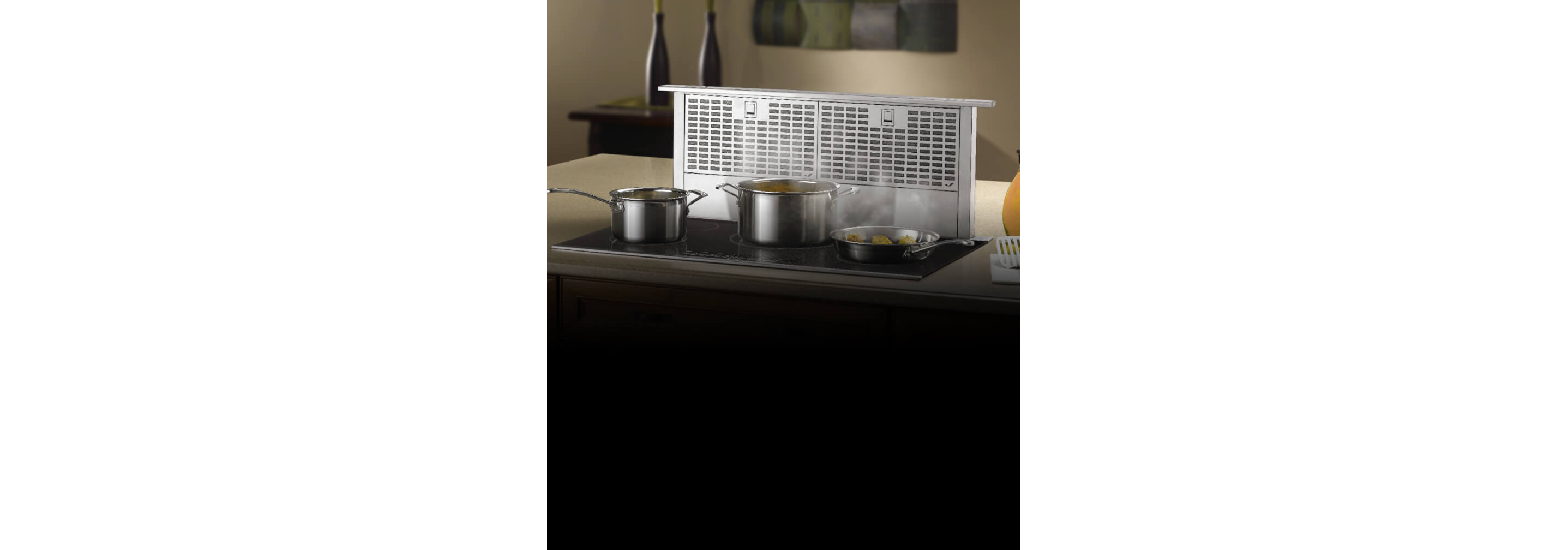 A telescoping downdraft ventilation hood.
